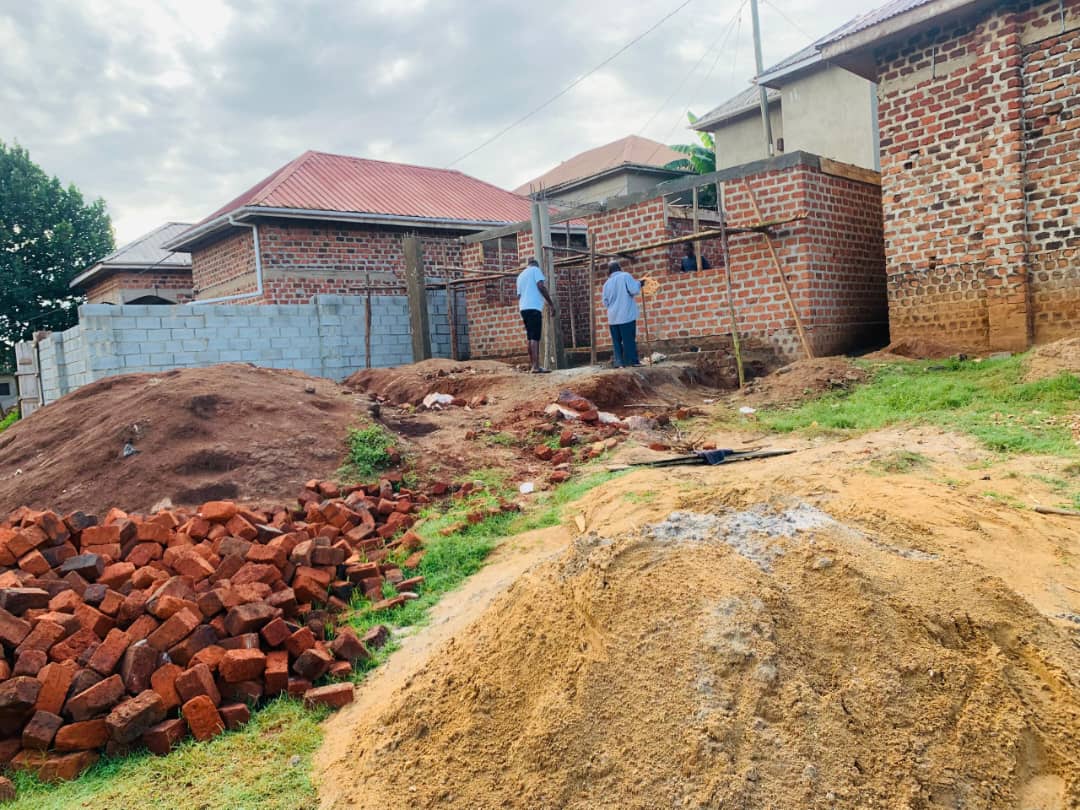 Stone retaining wall beside the part-built CORA children's home