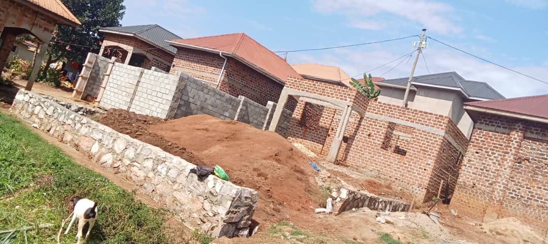 Brick walls of the CORA children's home rising with wooden scaffolding in place
